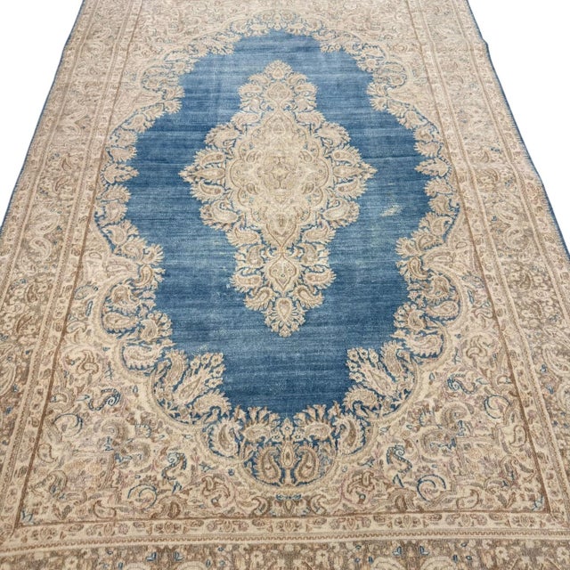 This beautiful antique rug showcases the intricate floral drawing and refined decorative quality associated with the...