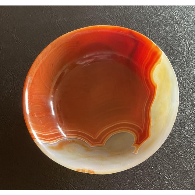 This is an antique Agate Bowl Red and White in Color. it measures approximately 4.5"diamater and 4" in height.