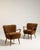 A cohesive pair of Danish shellback armchairs, combining soft curves with structured frames. The paired format enhances...