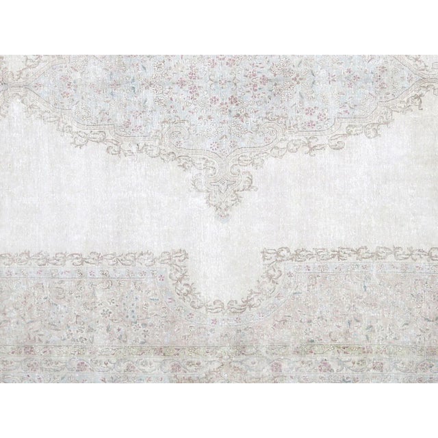 1950s Persian Kerman Carpet. Hand woven in the Kerman region of Iran. Distressed and refinished in the U.S. The Persian...