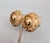 1971 round goldtone with round domed center and textured studded surround clip earrings. Marked "NAPIER PAT. PEND." on the...
