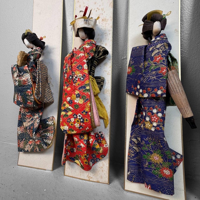 This special set consists of five Japanese geisha figures, hand-crafted from paper and textiles, each mounted on a narrow...