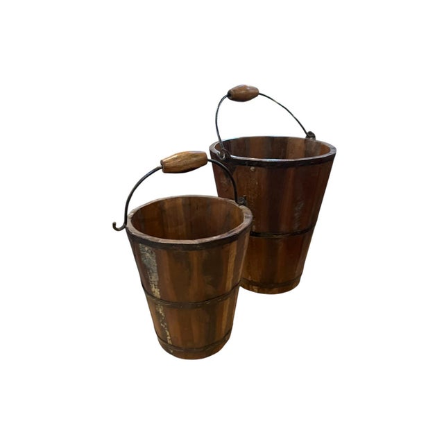Beautiful, heavy, reclaimed wood curved and formed into handsome buckets with iron and wood handles. The patina is warm...
