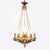 This early 20th-century French neoclassical chandelier is made from patinated bronze and gilt bronze, and brass. The...