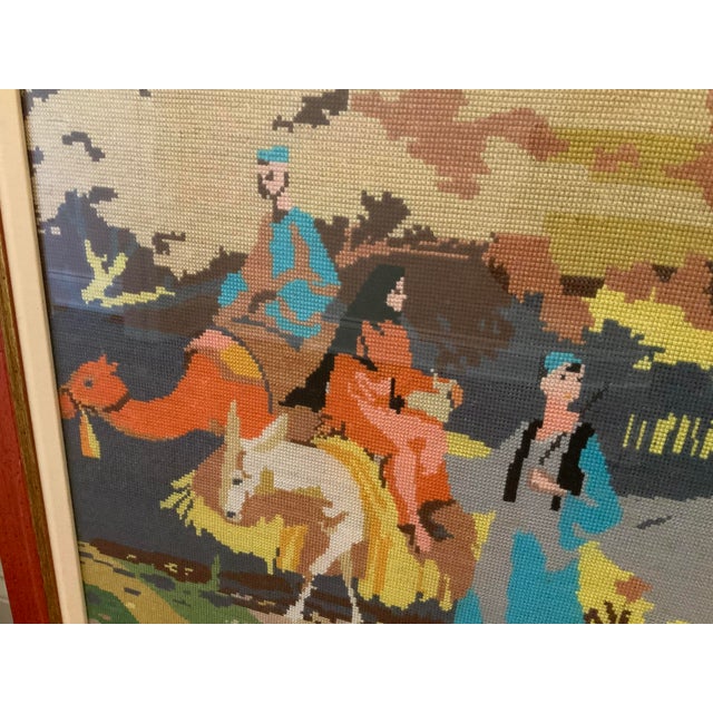 A whimsical depiction of Egyptian life along the Nile River done in vibrant colored threads. This needlepoint artwork is a...