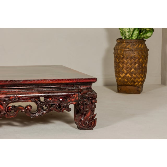 Qing Dynasty Low Kang Coffee Table with Reddish Brown Finish and Carved Décor For Sale In New York - Image 6 of 12