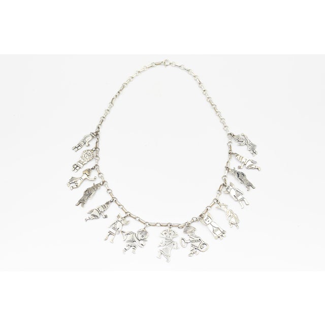 Southwestern Sterling Silver Figural Charm Necklace with 15 Figures, 925 An unusual sterling silver statement necklace...