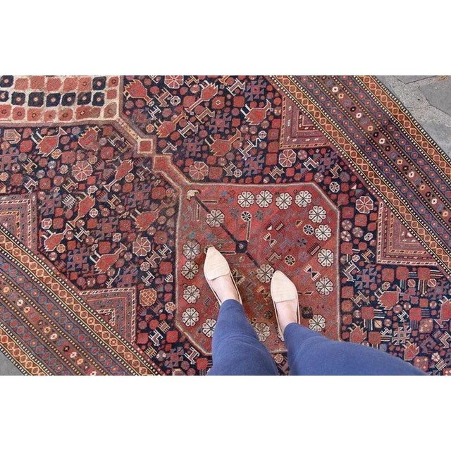 ✂ - - - - - m e a s u r e m e n t s: 5’7” x 11’9”, 170.2cm x 358.1cm, 19.5 Lbs C O L O R S Base: navy/terra cotta Accents:...