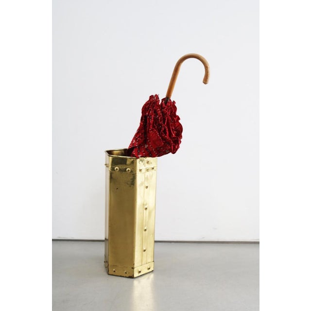 Mid-century modern design Brass parasol stand Made in Italy, 1960s Height 45.5 cm, Depth 20.5 cm, Width 20.5 cm Elegantly...