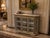 A spectacular statement piece, this richly detailed curio cabinet features an ornate gold and silver-toned finish, a...