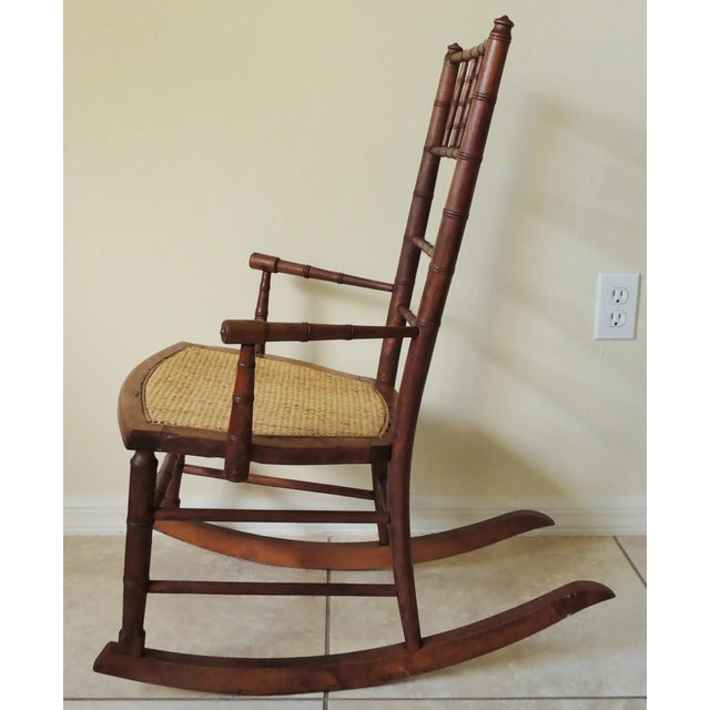 Wood Antique Early 20th Century Rj Horner Faux Bamboo Wood Wicker Seat Child's Rocking Chair For Sale - Image 7 of 11
