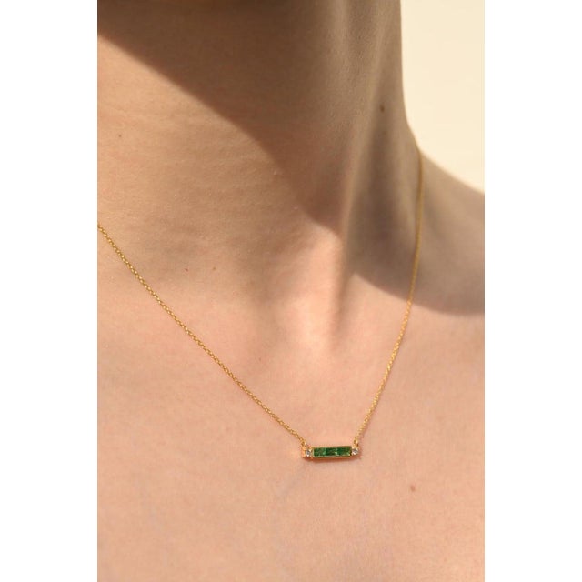 This is part of Chairish’s Fine Jewelry assortment. Diamond Emerald Baguette Bar Necklace in 14K Gold studded with...