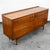 Vintage modern dresser featuring a raised edge, six drawers and rich walnut grain throughout. Manufactured by Broyhill....