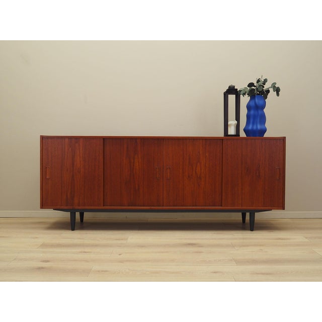 Sideboard manufactured in the 1970s by the renowned Danish manufacturer Westergaard Møbelfabrik. The structure is covered...