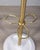 Floor coat rack with white cast iron base and gold-plated brass body, Italian design, 1960s.