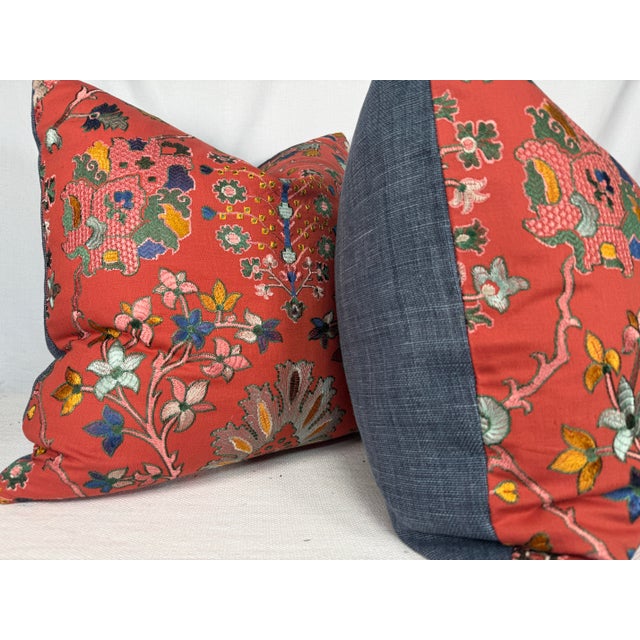 Custom pair of 22" pillows covered in an embroidered linen in an ikat pattern on a tomato colored linen and backed in a...