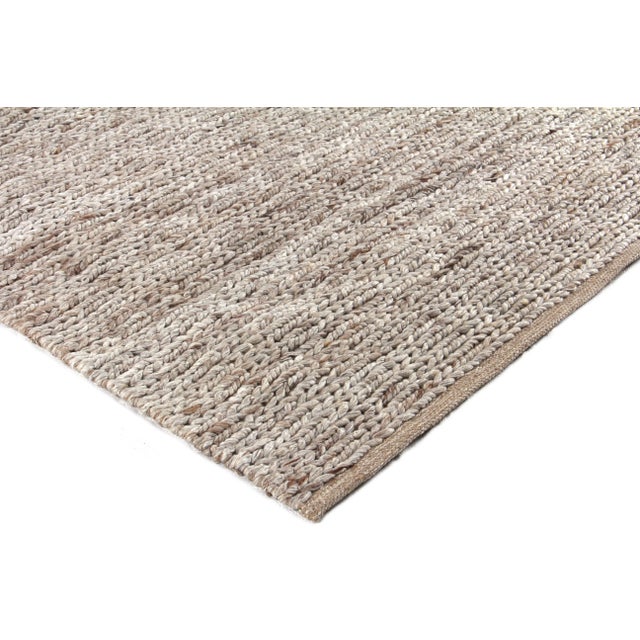 The James Rug brings together a remarkable blend of wool and polyester fibers and neutral tonal shades to create a...