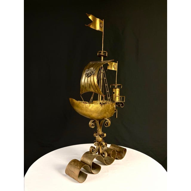 Dramatic and architecturally composed Brutalist-style maritime sculpture executed in gilt metal with an aged patinated...