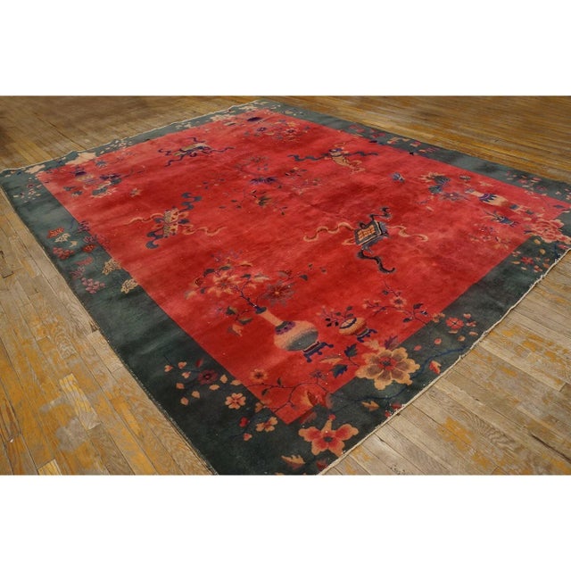 Antique Rectangle Red Hand Knotted Pile 1920s Wool Rug, Circa Date: 1920s. This exceptional wool pile piece exemplifies...