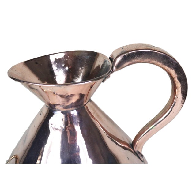 A traditional English copper liquid measure with a four gallon volume dating from the late 19th century. This shape is...