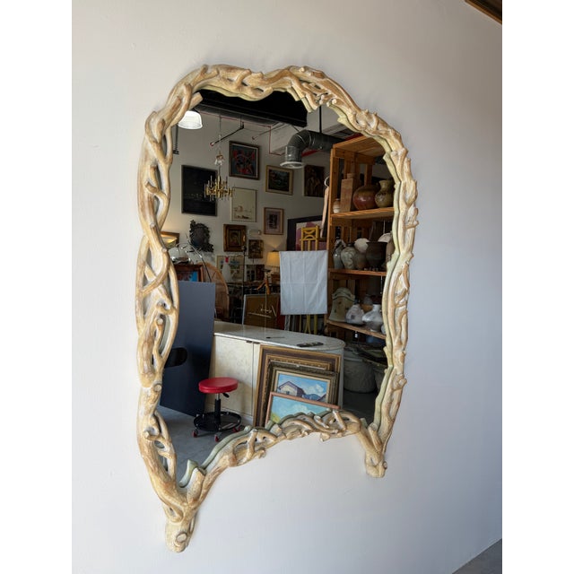 A stunning example of 1970’s Italian coastal design, this sculptural wall mirror features an intricately carved faux bois...