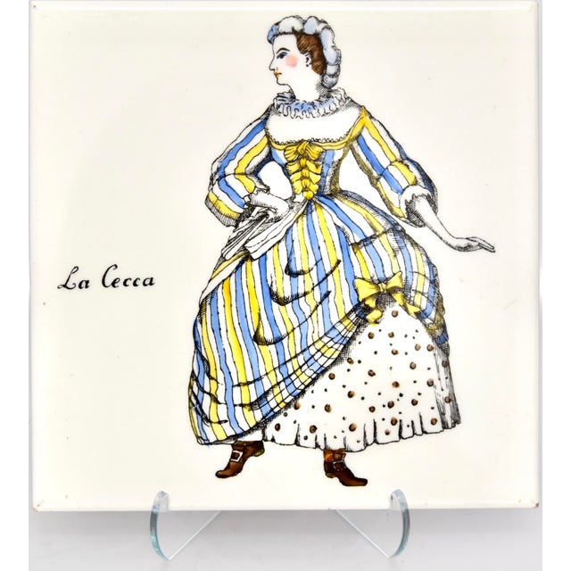 A pair of rare and very stylish plaques from the "Commedia dell'Arte" series, circa 1955 by Piero Fornasetti. Each depicts...