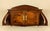 An Art Nouveau wall cabinet made of solid oak in France around 1900. The piece features a characteristic organic shape...