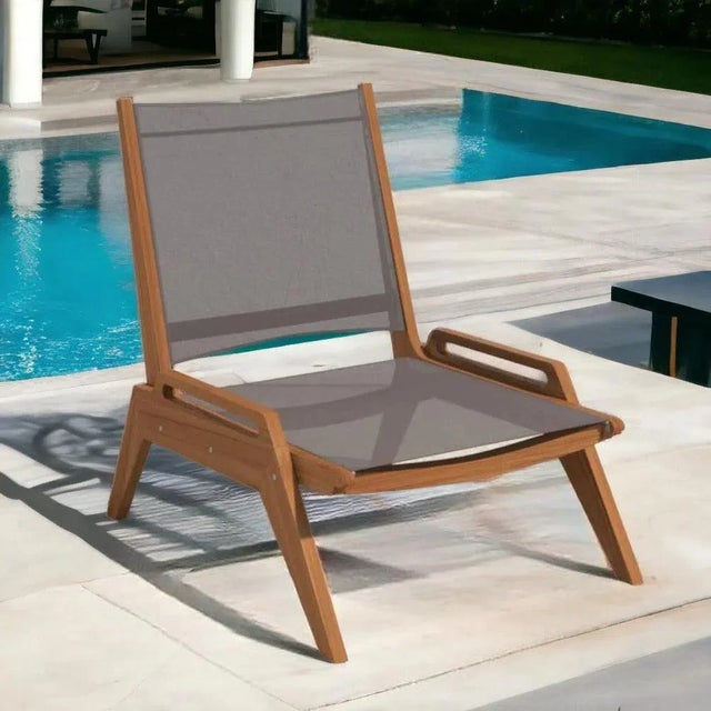 Enhance your outdoor living with the Draper Sling Chat Chair by Hi-Teak. Constructed from premium teak and durable,...