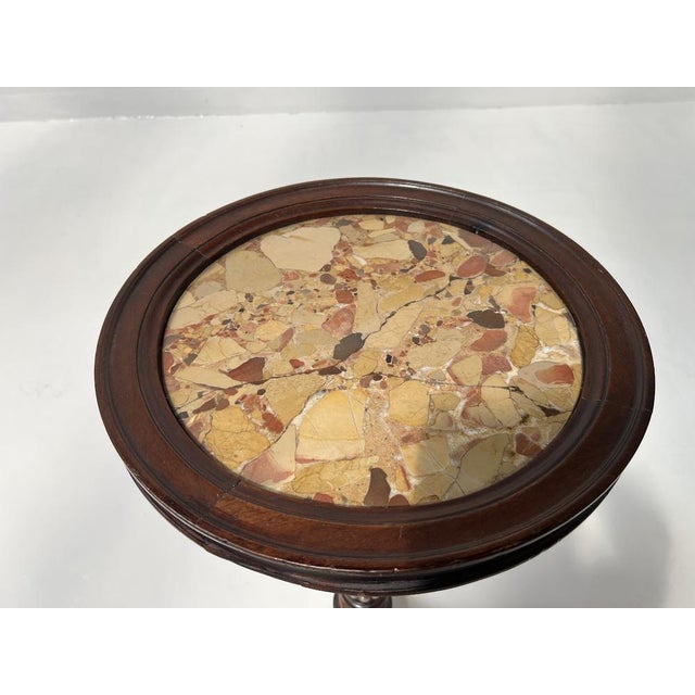 Napoleon III style pedestal table in walnut and marble Tripod base with a carved central shaft Circular marble top Old...