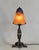 Daum A wonderful 1925-30 French art deco lamp in wrought iron of excellent quality. The forged base holds a large shade in...