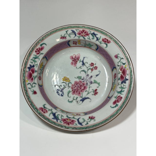 A pair of Yongzheng period Chinese export famille rose porcelain small plates. In the center an asymmetrical, elegant...