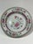 A pair of Yongzheng period Chinese export famille rose porcelain small plates. In the center an asymmetrical, elegant...