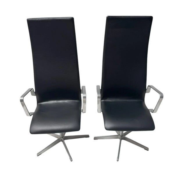 Stunning and elegant pair of Danish Modern highback Oxford lounge chairs. Design by Arne Jacobsen for Fritz Hansen....