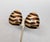 1980s goldtone domed triangular with rounded edges brown enamel striped clip earrings. Marked "CINER®" on the clips and...