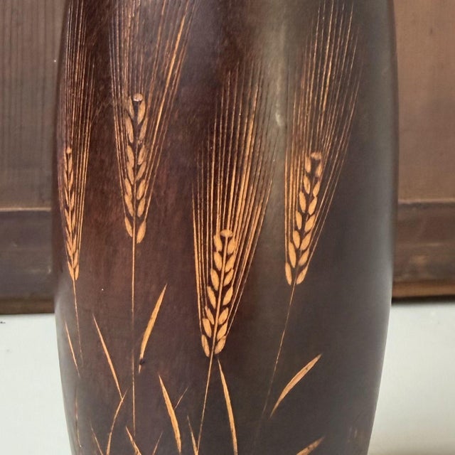 Elegant vintage kokeshi by the renowned master Okamoto Usaburo, titled “Bakushū” — literally “wheaten autumn”, a Japanese...