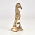 Charming mid century seahorse sculpture or object of art crafted in cast brass in a stylized art deco form.