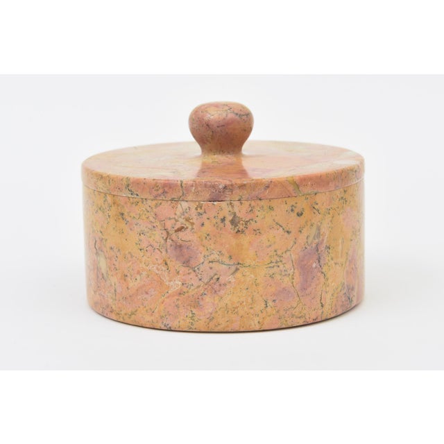 This lovely vintage 1950's soapstone box has wonderful tonal range of colors. The colors are mottled aray of pink, orange...