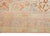 This antique Turkish Oushak rug, dating to the early 1900s, features a beautifully weathered palette of soft terracotta,...