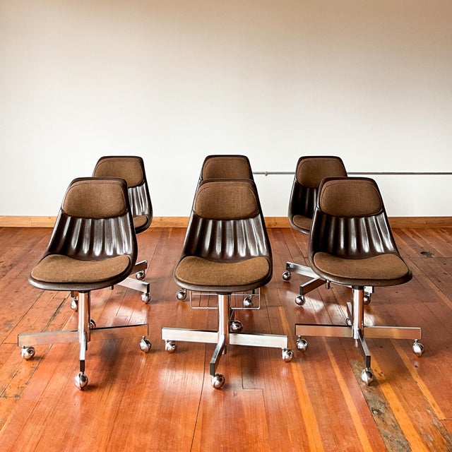 These Clarin Corporation fiberglass desk chairs have a unique design and appearance due to the factory-made duo of...
