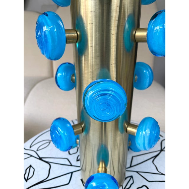Pair of table or bedside brass lamps blue Murano glass spiral balls. Contemporary work from a small italian artisanal...