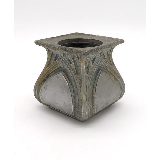 A striking small Art Nouveau vessel in pewter/spelter, in the sinuous "whiplash" style associated with French designer...