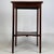 A refined and beautifully crafted early 20th-century English Edwardian side table, finely constructed in mahogany and...