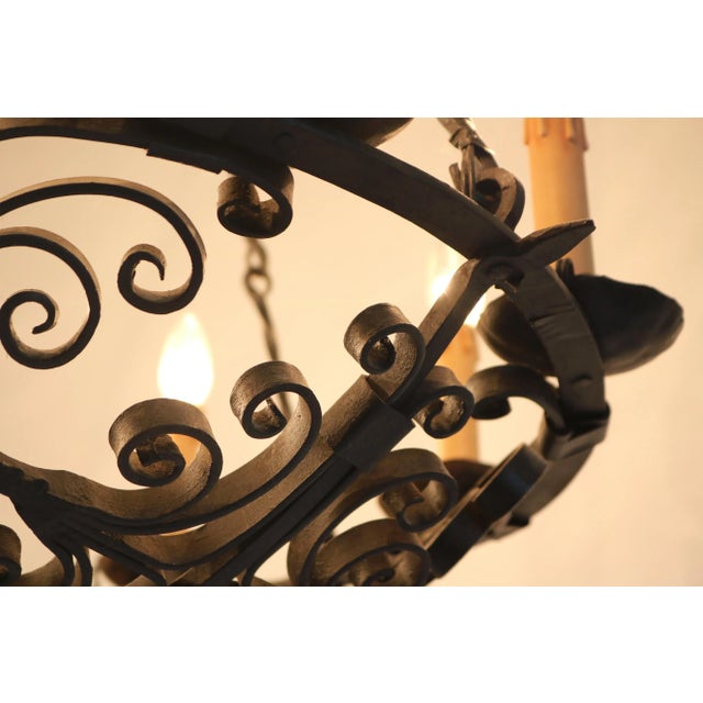 A truly impressive late 19th-century wrought iron chandelier, entirely handcrafted around 1880–1890. This exceptional...