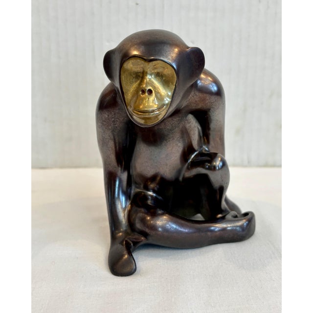A formidable heavy bronze patinated figure with a " gold " highlighted face An outstanding desk top or shelf accessory