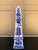 A stunning neoclassical, Chinoiserie, or Grand Tour style blue and white porcelain obelisk Measures: 3.75"W x 3.75"D x...