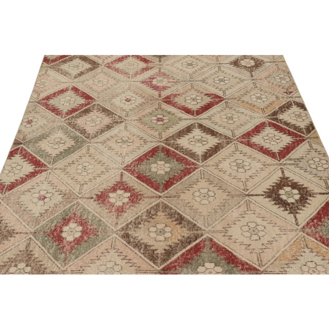 This vintage rug is a 5x9 Turkish distressed piece, made with hand-knotted wool circa mid-20th century. It is an exciting...