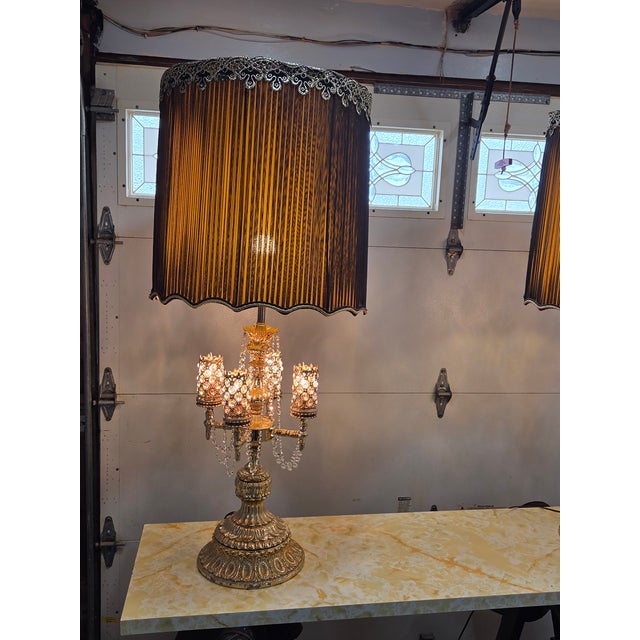 Quantity 2 46-inch height including shade, gold leaf finish lamps, four light settings, and the crystals are 100% intact,