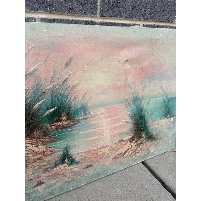 Vintage original oil painting on canvas signed “K. Cummings” in the lower-left corner. The tranquil coastal scene features...
