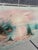 Vintage original oil painting on canvas signed “K. Cummings” in the lower-left corner. The tranquil coastal scene features...