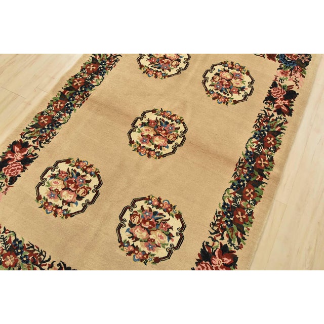 An authentic vintage traditional Bakhtiari rug hand-knotted with fine wool and natural dyes. This intricately woven rug...